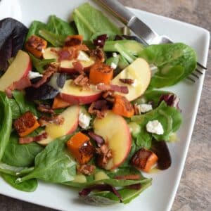 Butternut squash apple salad with candied pecans and apple cider vinaigrette.