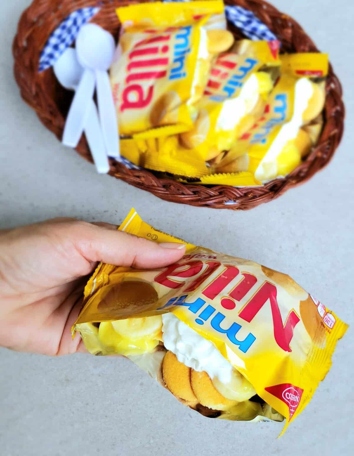 banana pudding in vanilla cookie bags in a basket and close up