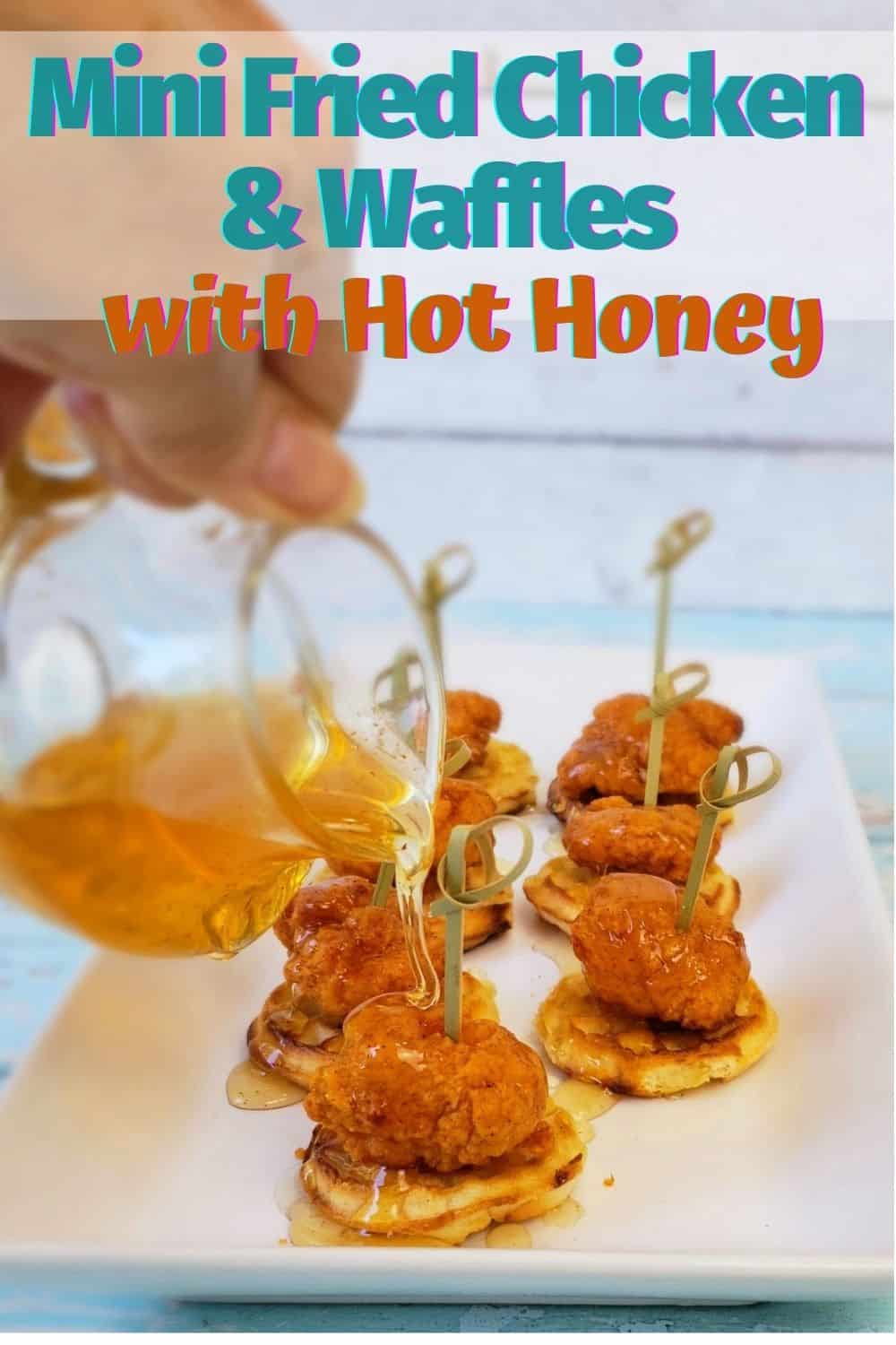 Hand pouring honey on chicken nuggets and waffles with text overlay