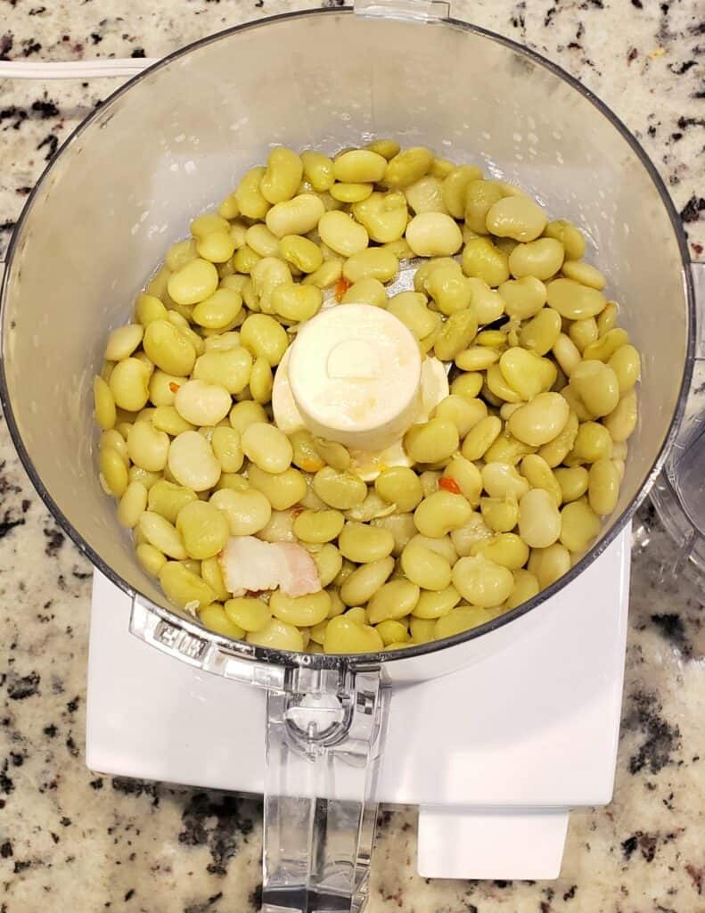 Cooked lima beans in a food processor.
