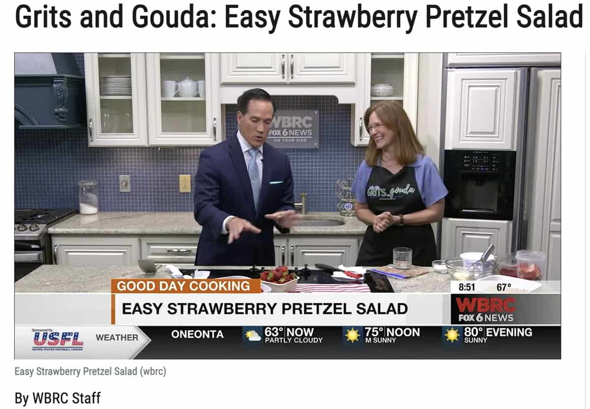 Man and woman in WBRC tv kitchen making strawberry salad with text overlay