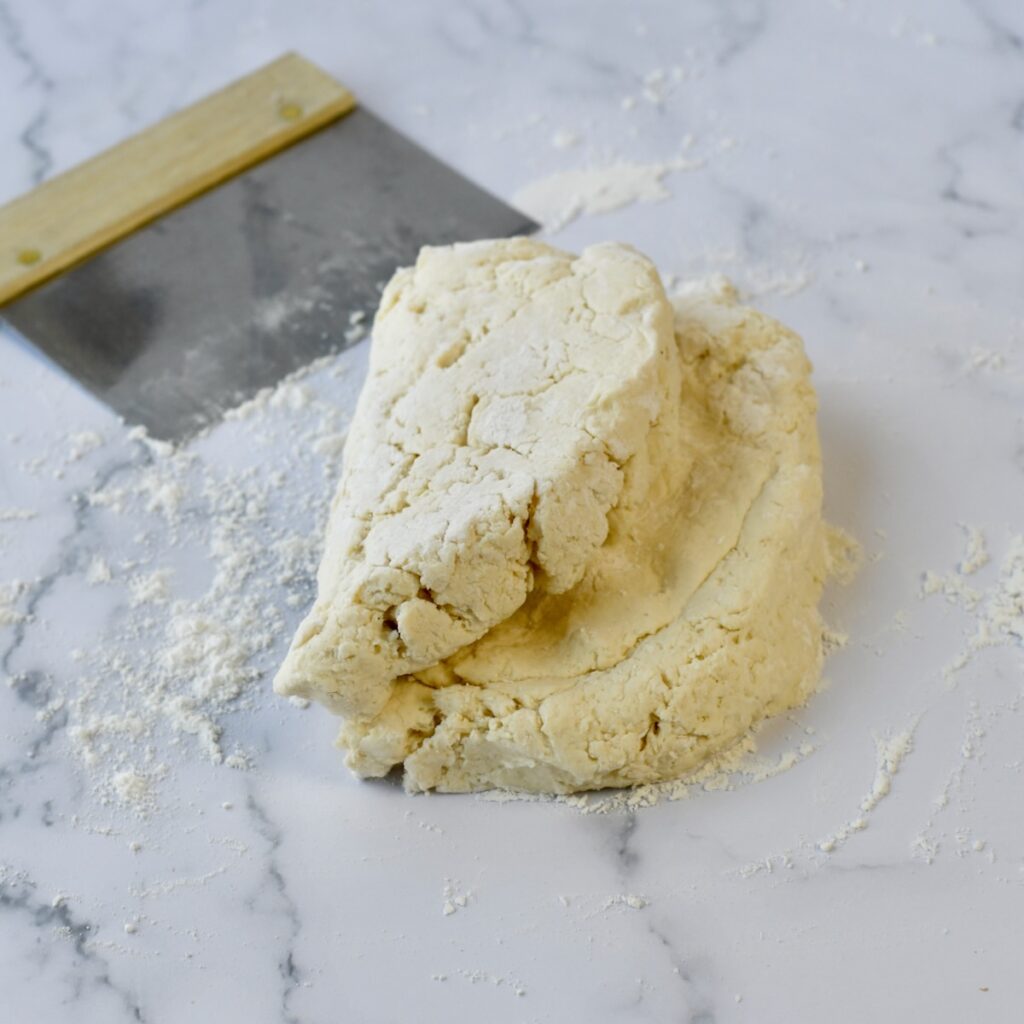 Biscuit dough folded in half.