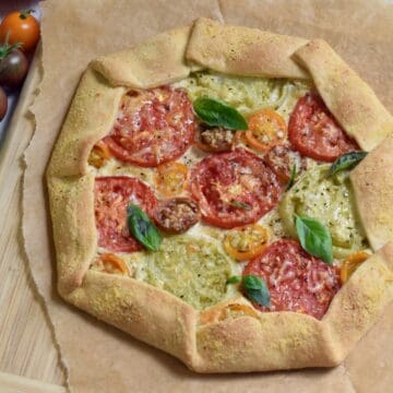 Overhead view Tomato Galette on parchment paper.