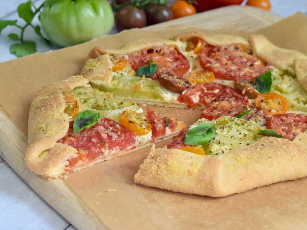 Side view Tomato Galette with slice pulled out.