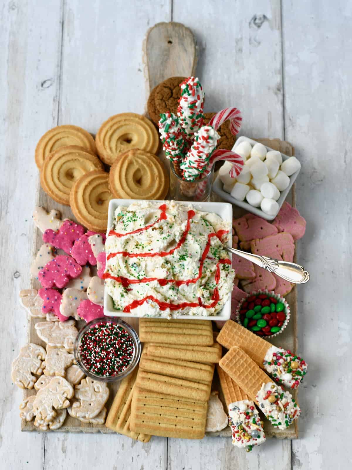 Little Debbie Christmas tree cake dip in middle of dessert board.