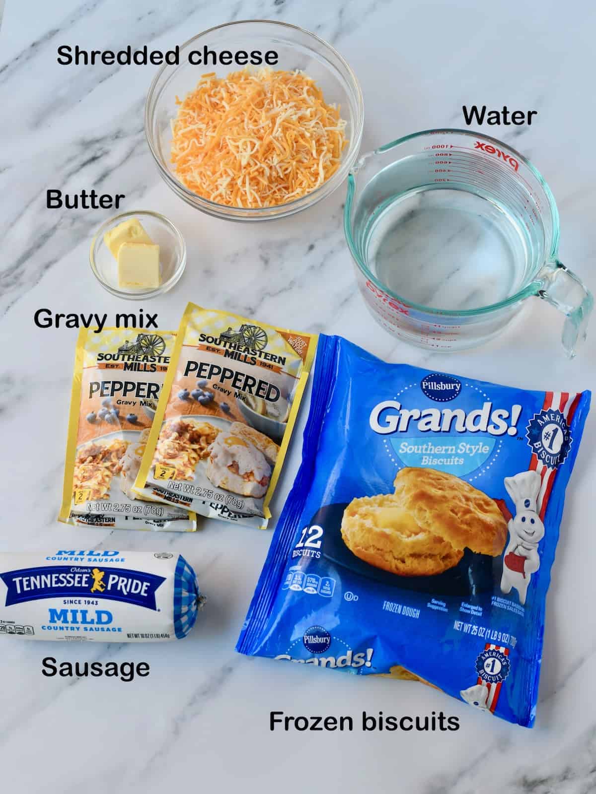 Ingredients for Sausage Gravy Biscuit Casserole with labels.