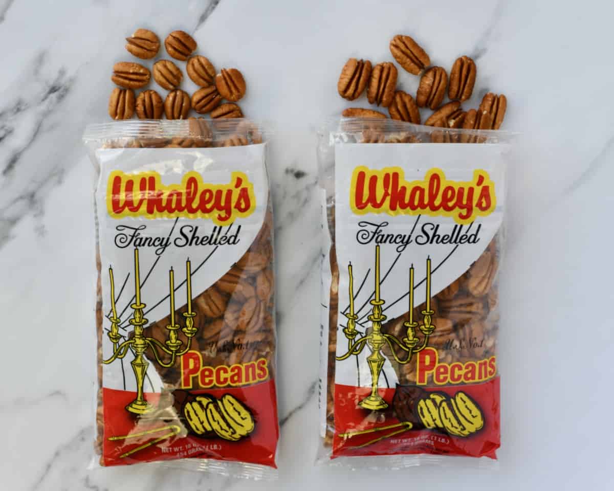 Two bags of Whaley Pecan Company pecan halves.