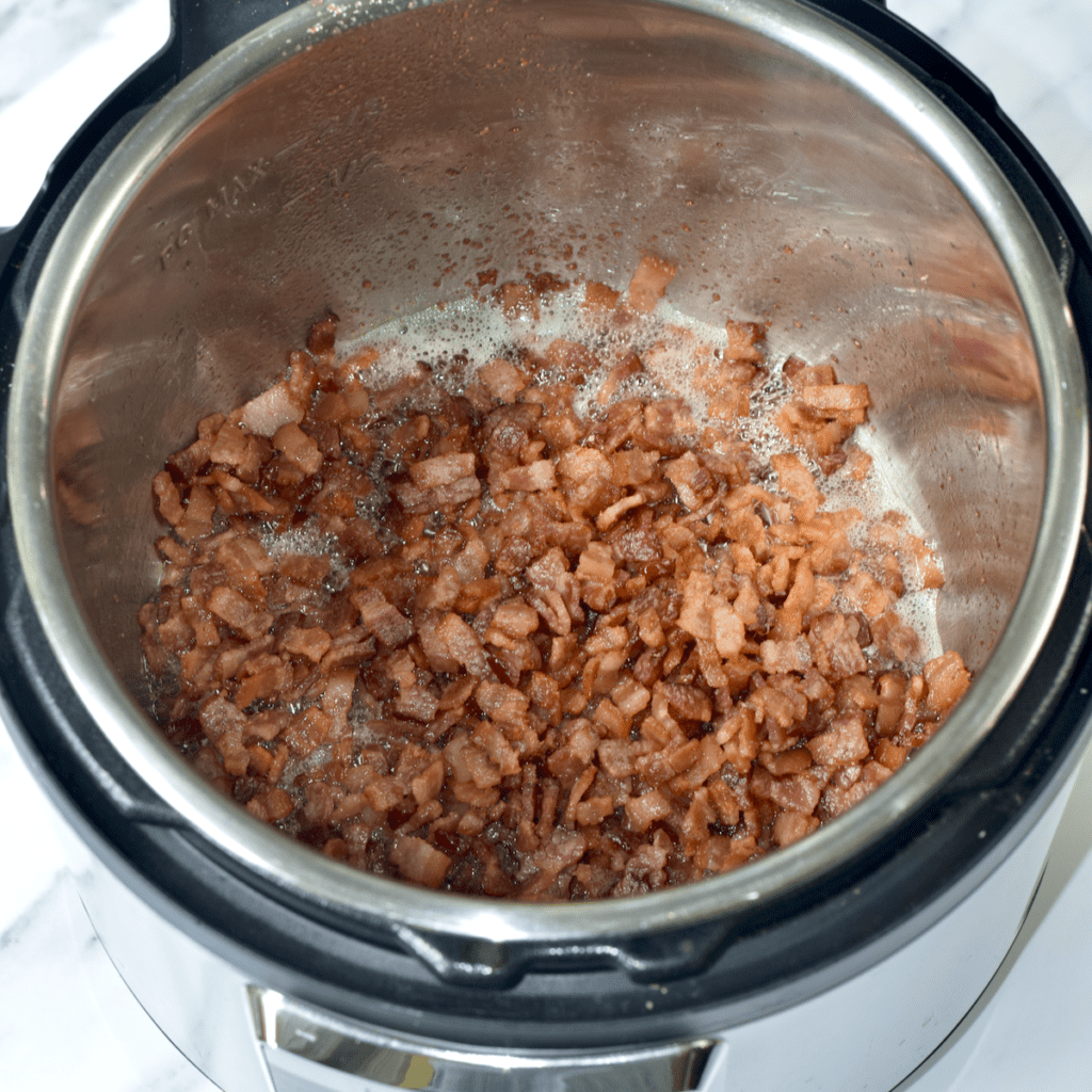 Instant Pot bowl filled with sauteed chopped bacon