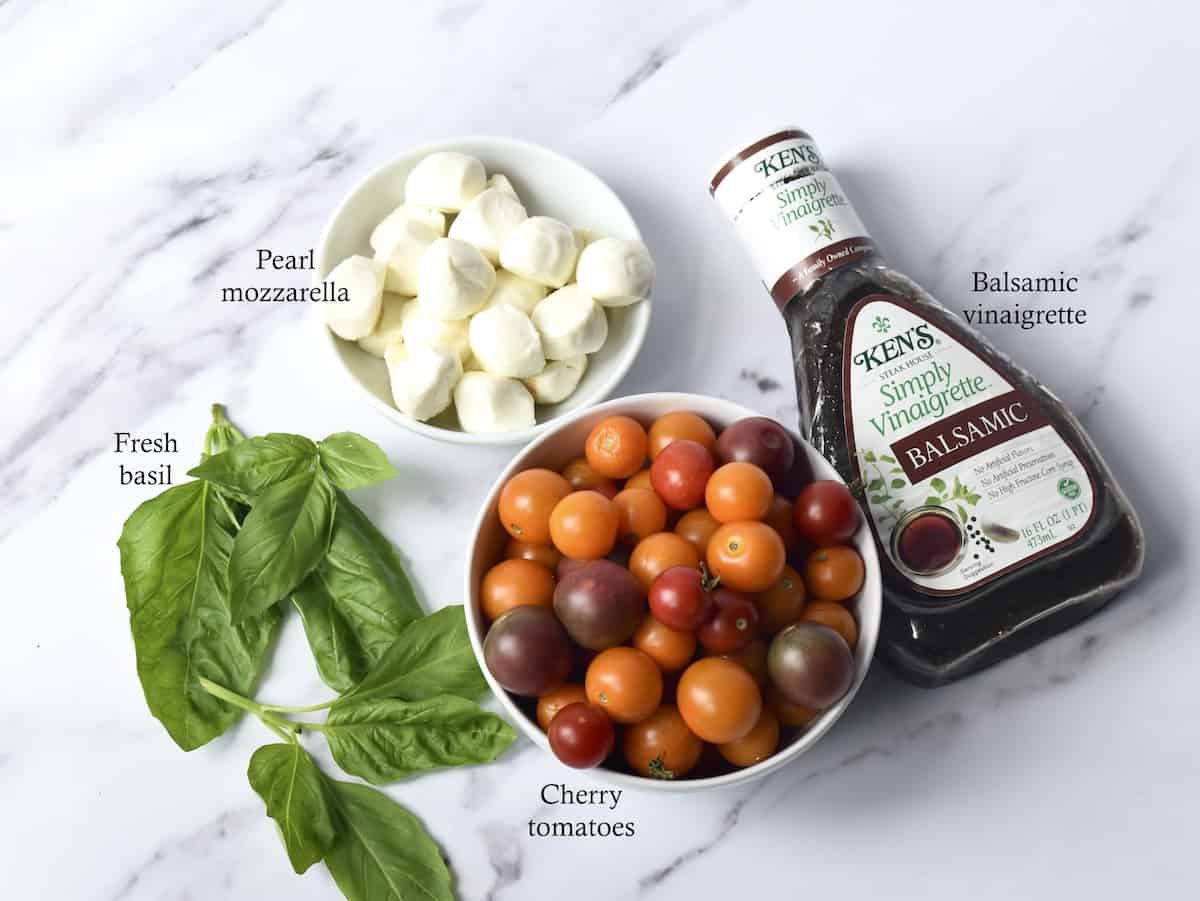 Caprese salad recipe ingredients set into individual bowls.