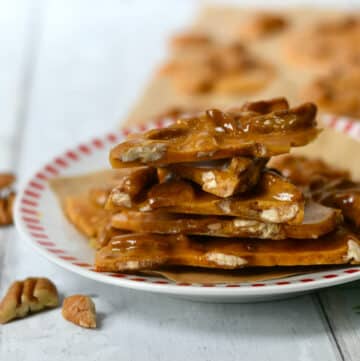 Stack of pecan brittle on a plate.
