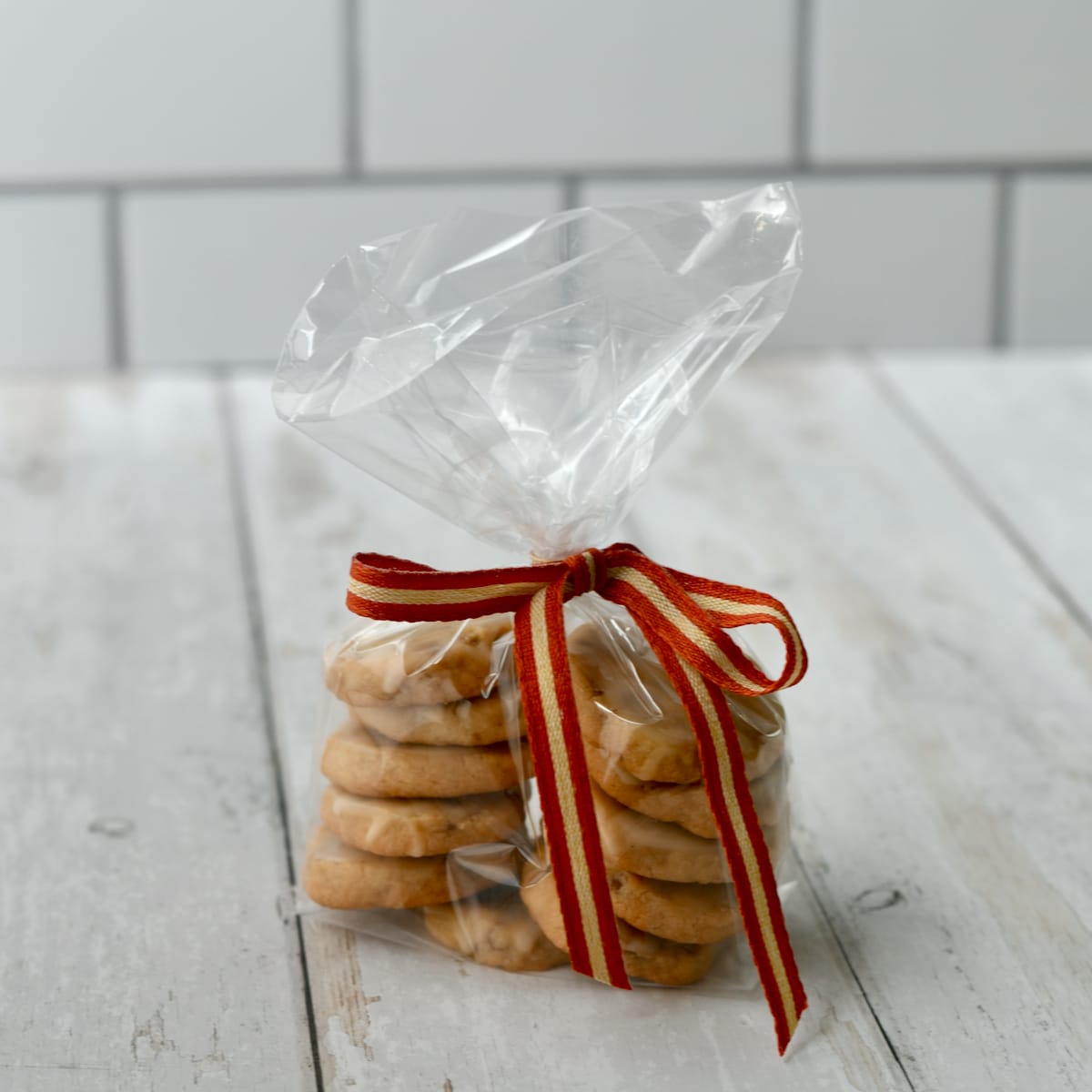 Maple pecan cookies in cellophane gift bag tied with ribbon.