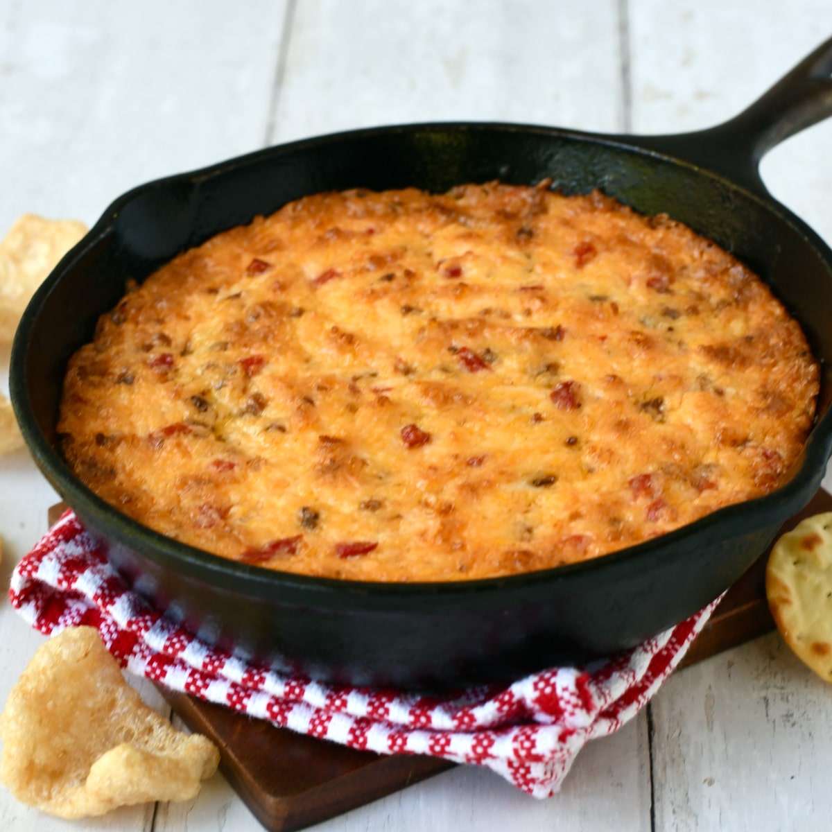 warm pimento cheese dip with bacon in a cast iron skillet.