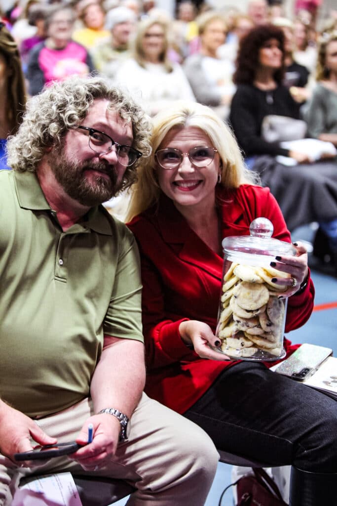 Man and woman holding cookie jar. holly chris
