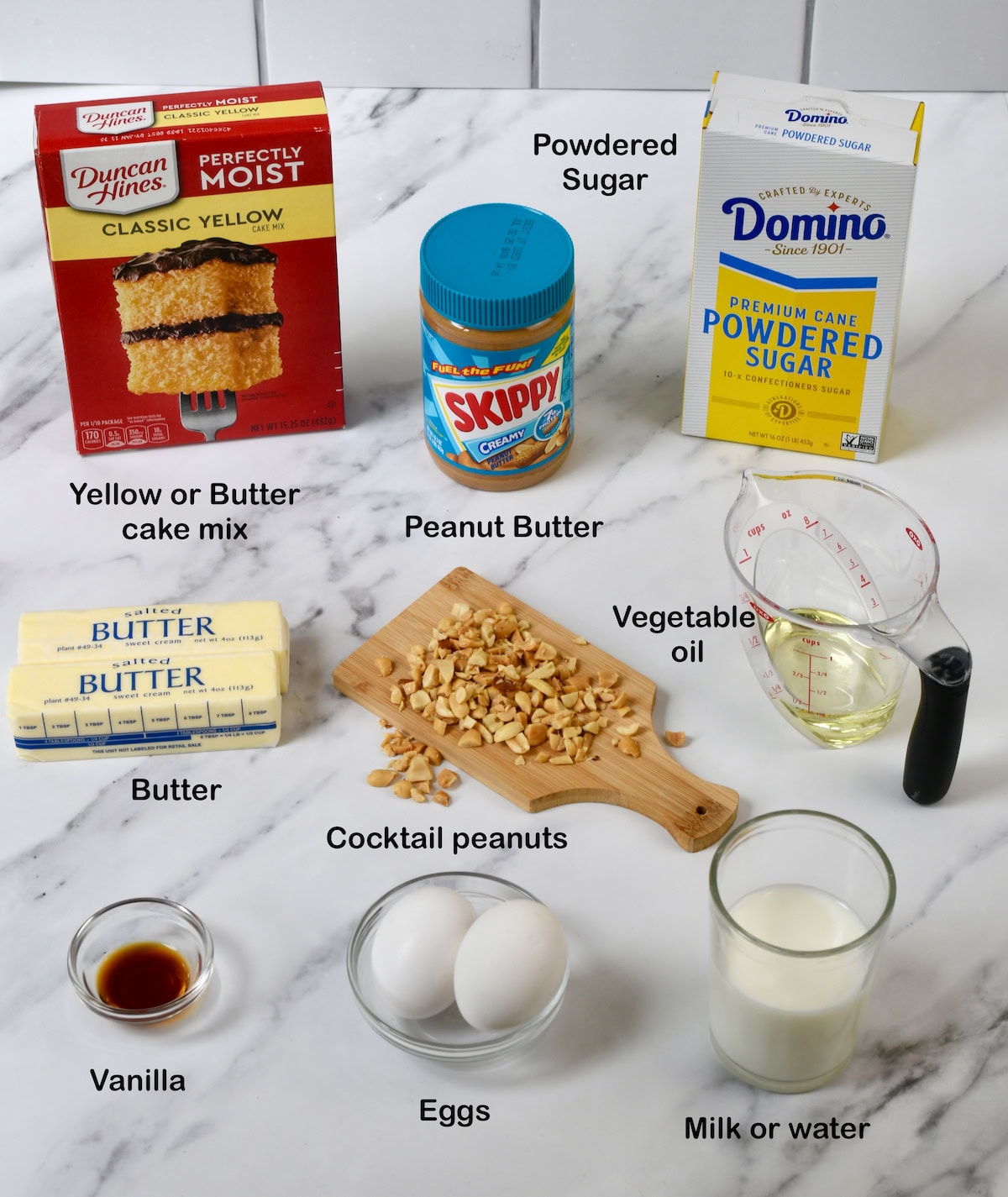 Ingredients for Peanut Butter Sheet Cake: cake mix, peanut butter, powdered sugar, butter, oil, peanuts, eggs, milk, vanilla.
