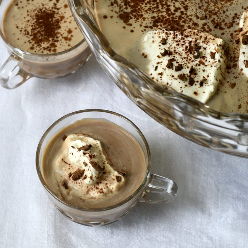 Shortcut Mocha Punch in Fostoria punch bowl in punch cups sprinkled with chocolate shavings and cocoa.
