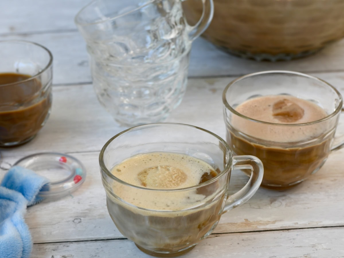 Glass cups filled with coffee punch, each topped with a scoop of melting ice cream