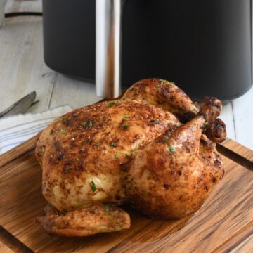 Roasted whole chicken by an air fryer.
