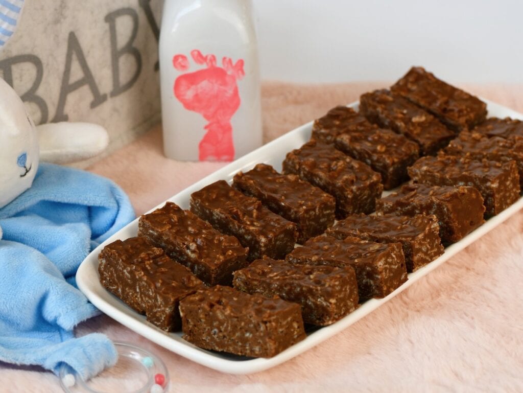 Finger food chocolate peanut butter rice crispy treats bars for baby shower.