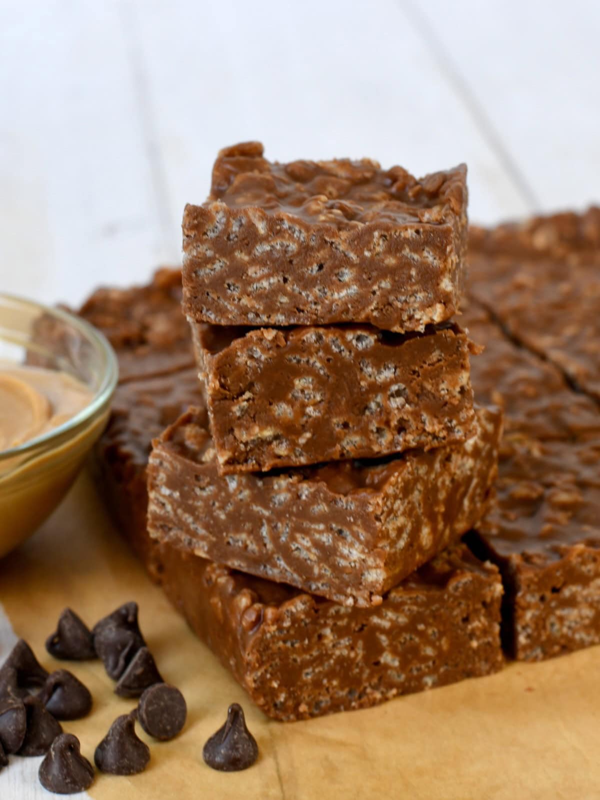 A stack of four peanut butter chocolate rice krispie squares.