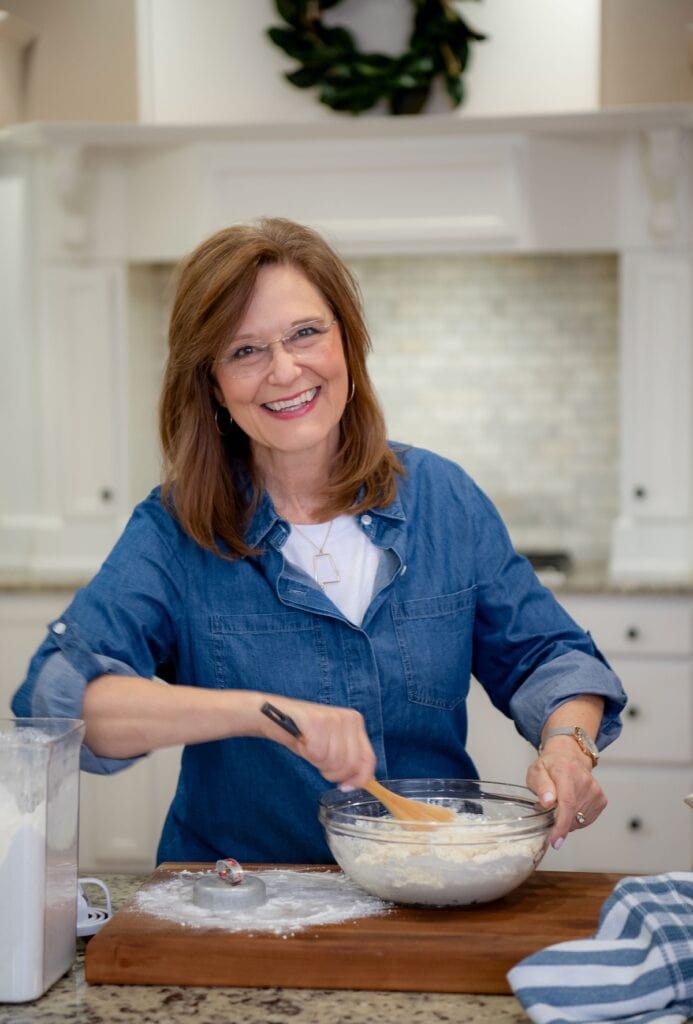 Woman in blue denim shirt stirring biscuits Kathleen 