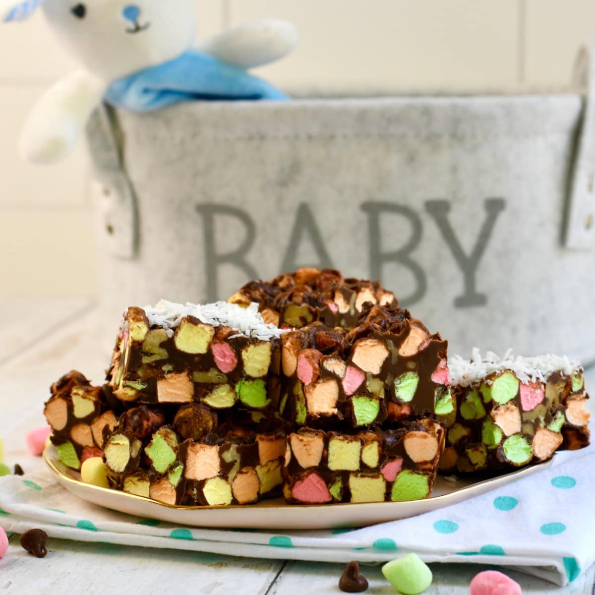chocolate cathedral window bars, sliced into squares on a white plate