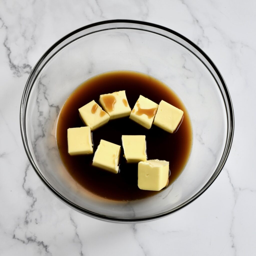 Cubed butter and coffee in a glass bowl 