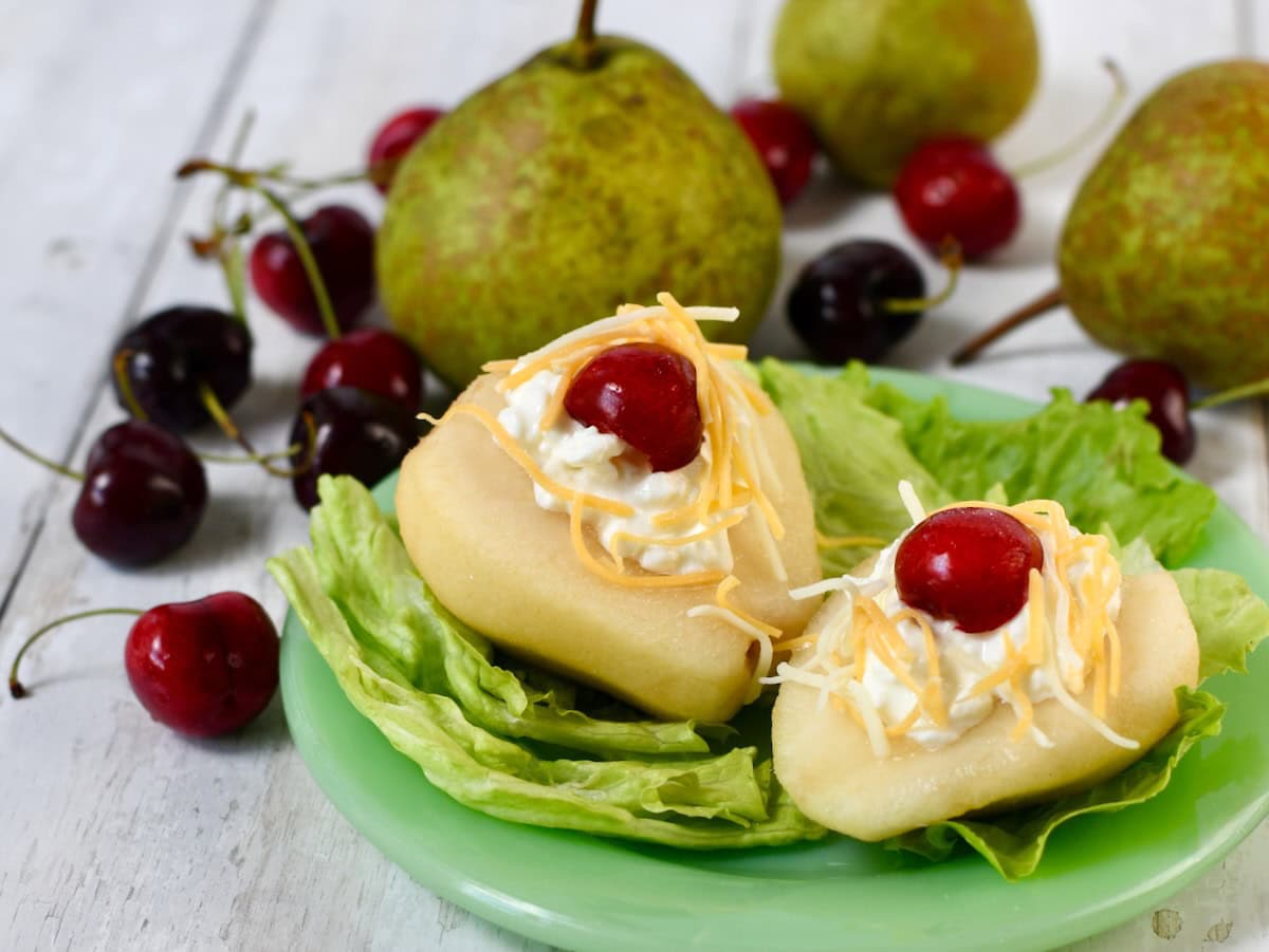 Southern pear salad with fresh pears on a plate with lettuce leaves.