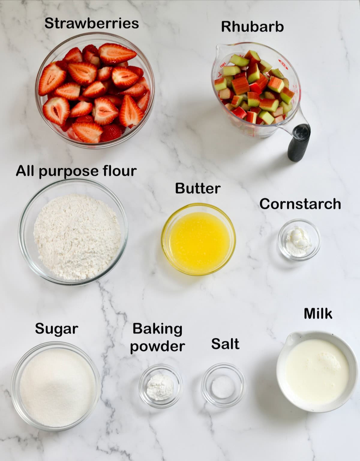 Ingredients needed to make strawberry rhubarb cobbler.