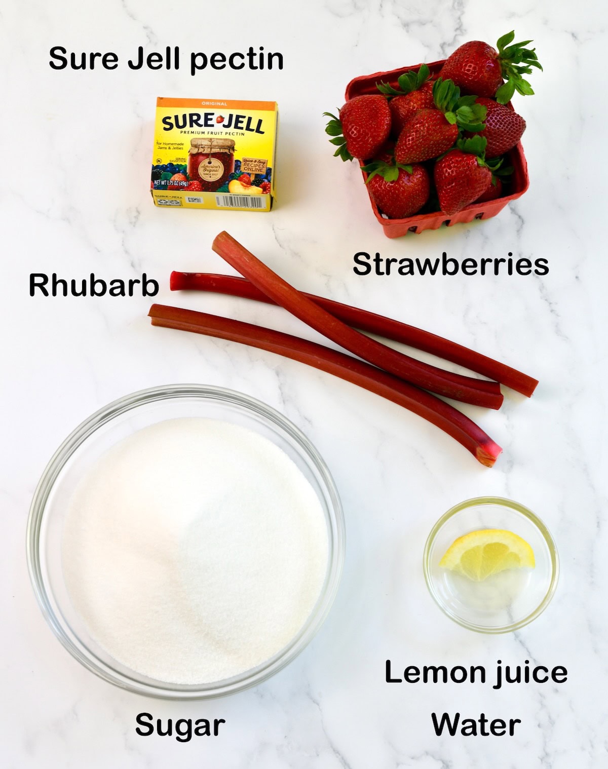 Ingredients needed to make strawberry rhubarb freezer jam.