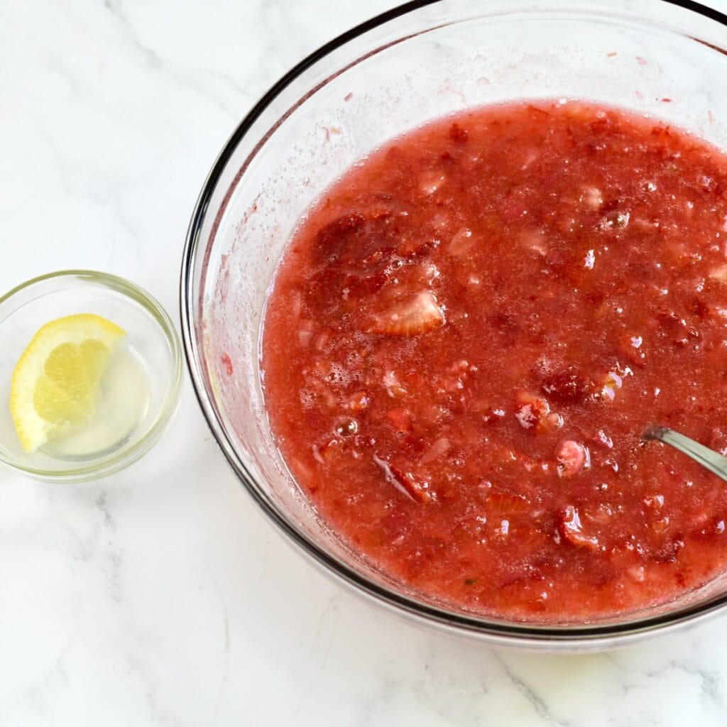 Strawberry and rhubarb mixture mixed together in a bowl.