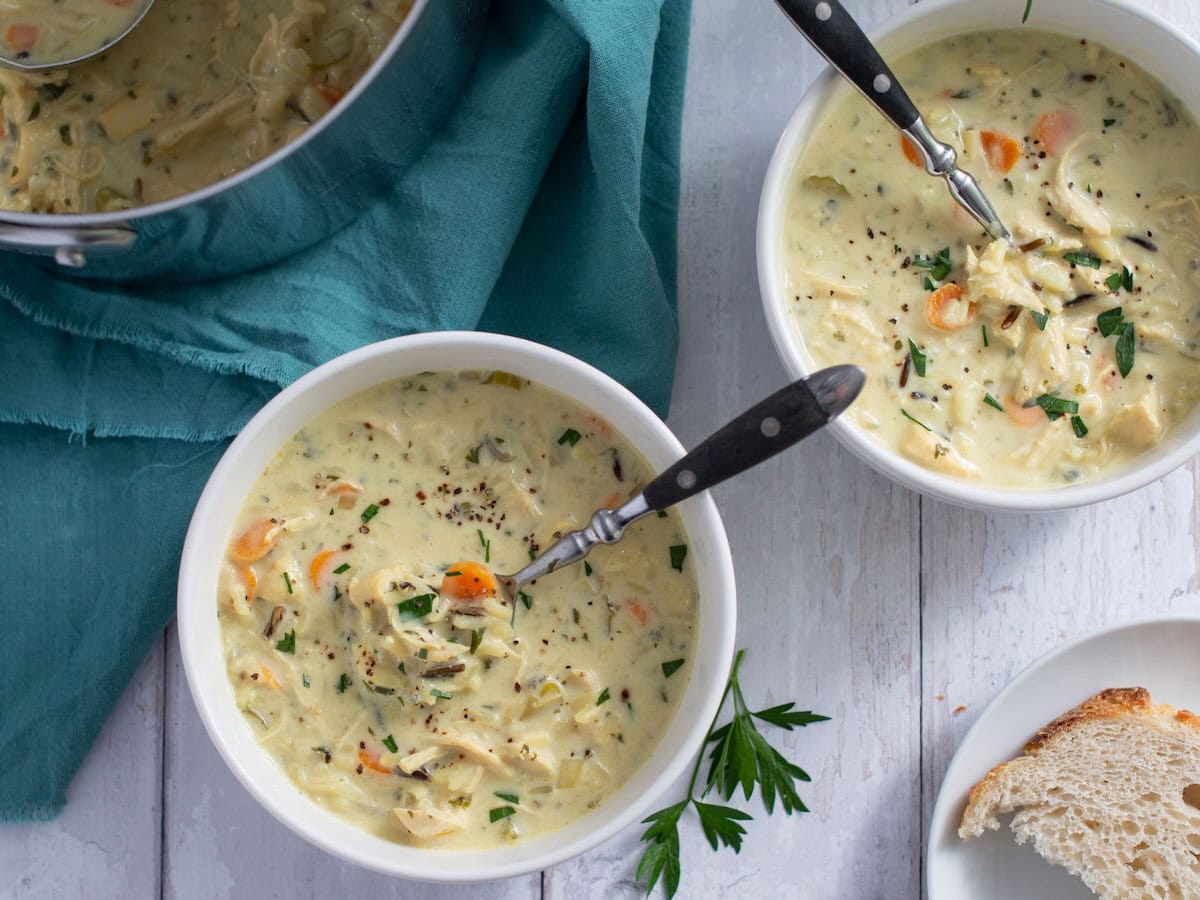 Overhead shot of two bowls of chicken wild rice soup.