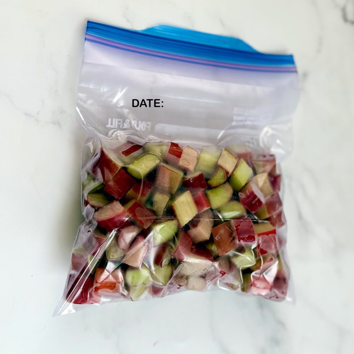 Frozen rhubarb placed in a ziplock bag.