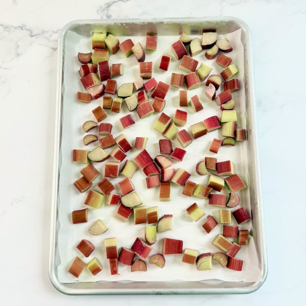 Frozen chopped rhubarb on a sheet pan.