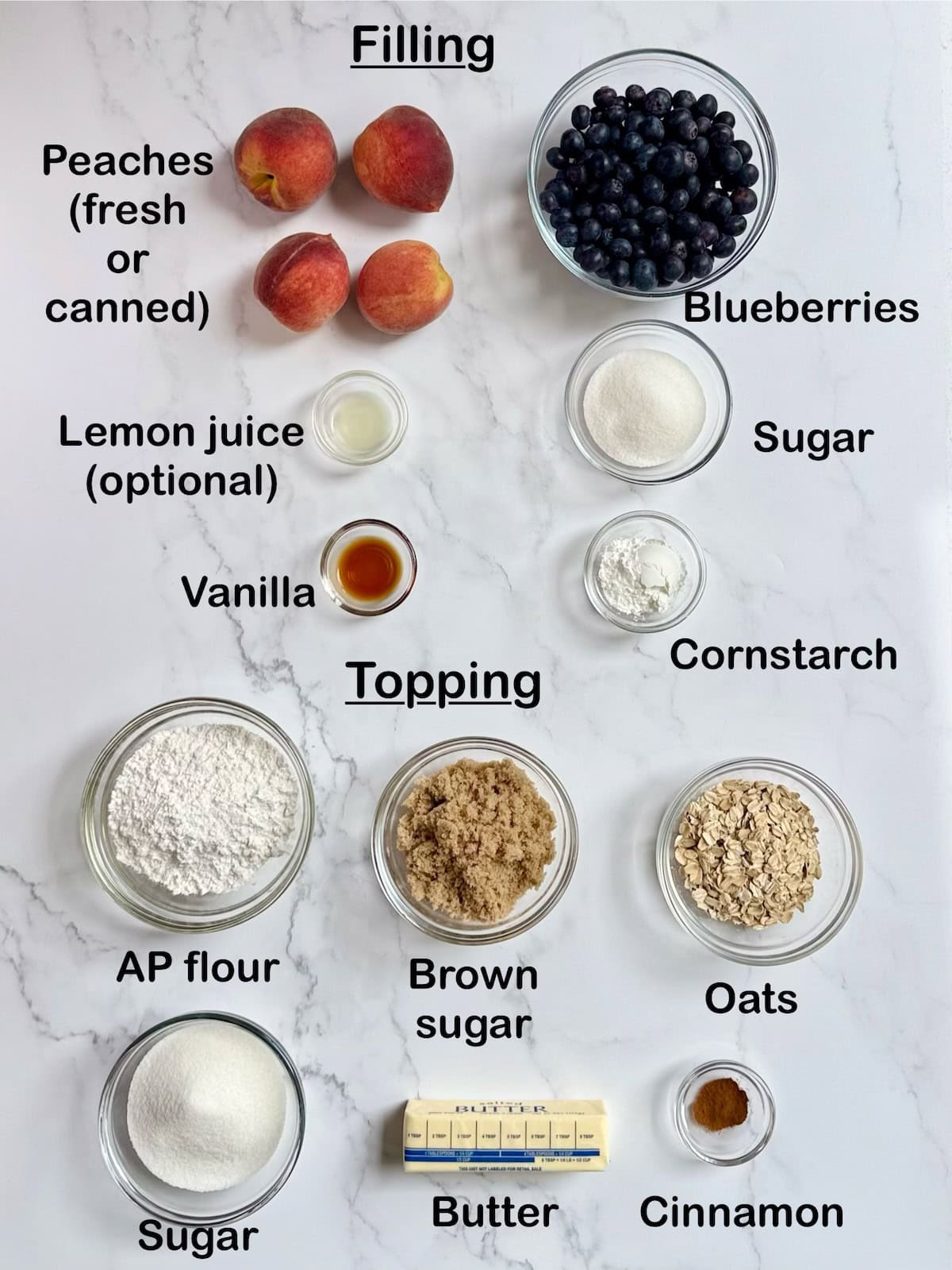 Ingredients needed to make peach blueberry cobbler on a kitchen counter.