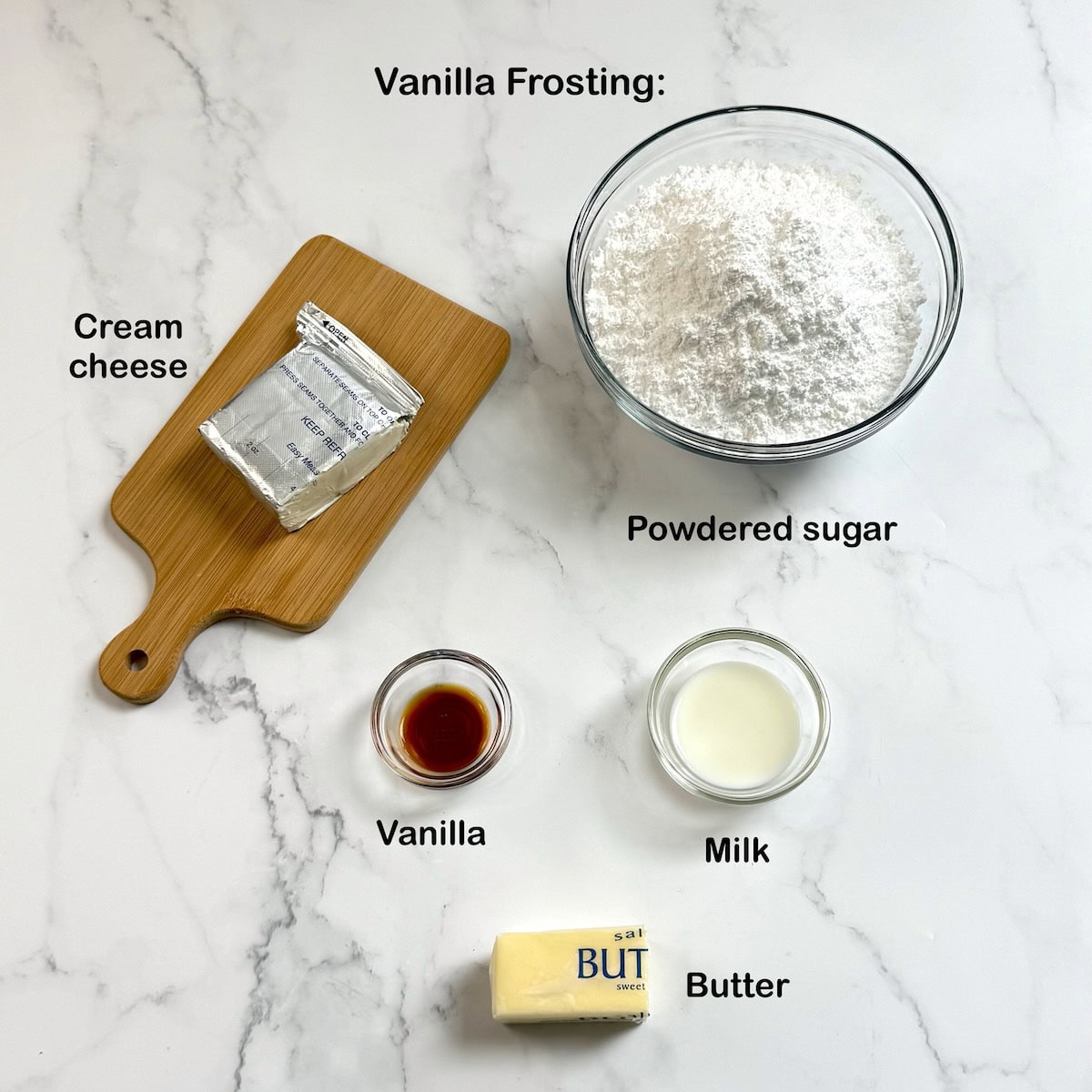 Ingredients needed to make the cream cheese frosting on a kitchen counter.