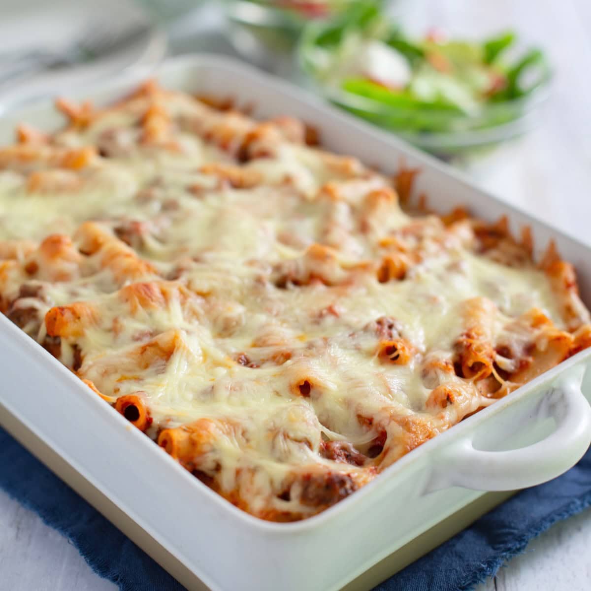 Easy baked ziti in a white baking dish.