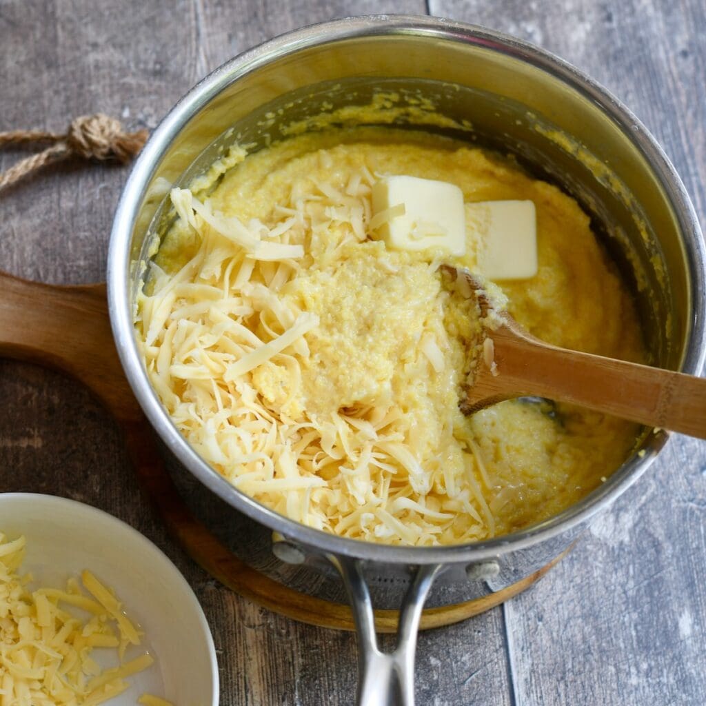 Shredded gouda and butter added to the grits.