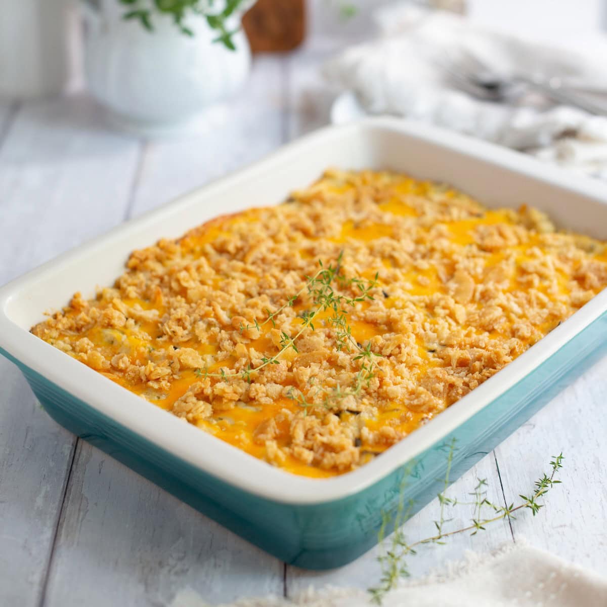 Baked chicken and wild rice casserole garnished with thyme.