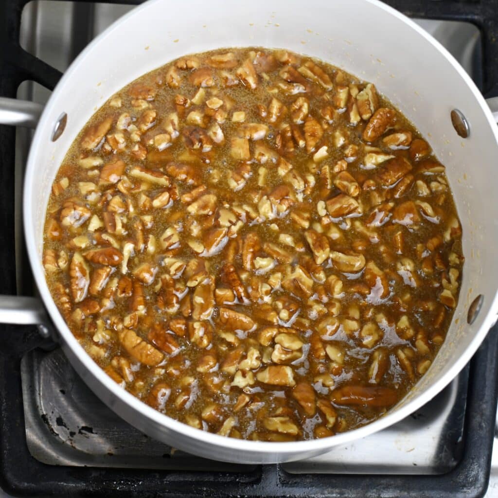 Making the pecan topping in a saucepan on the stove.