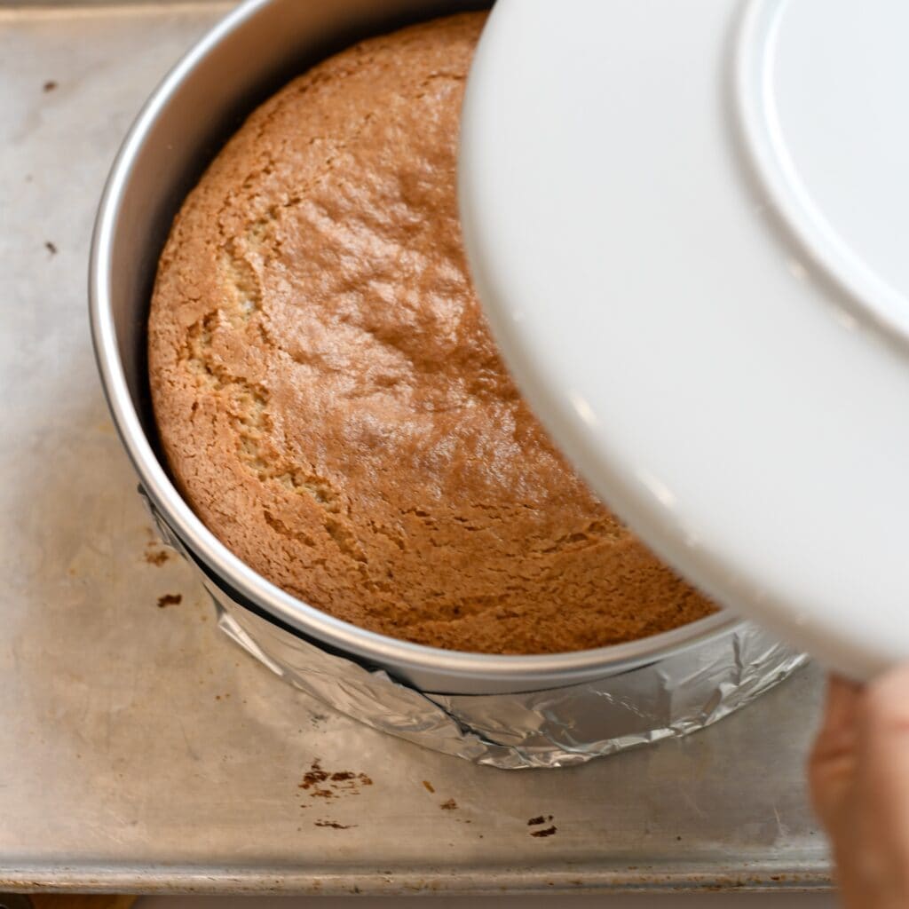 Baked pecan upside down cake in the cake pan before turning it over.