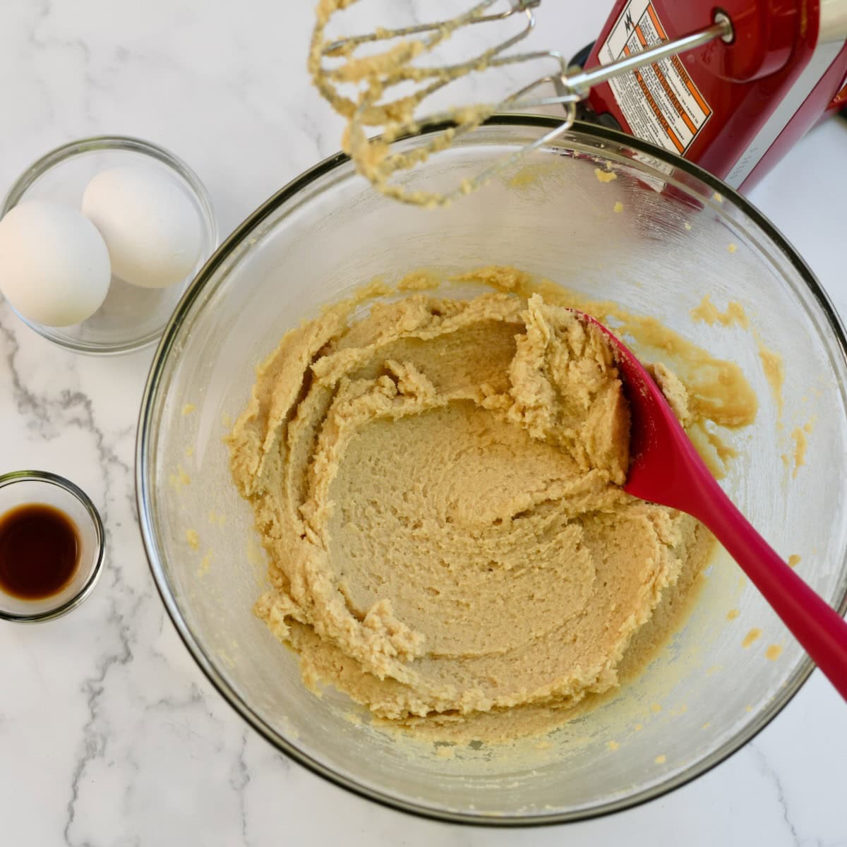 Butter and sugar creamed together in a bowl.