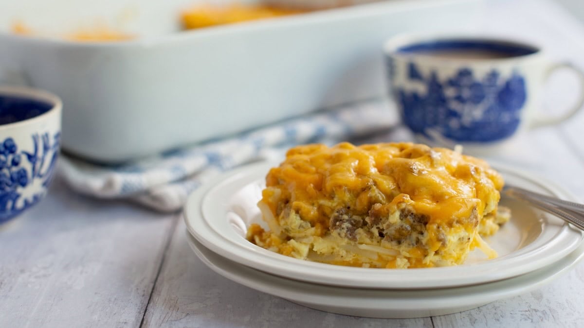 Side view of sausage and hashbrown breakfast casserole on a plate.